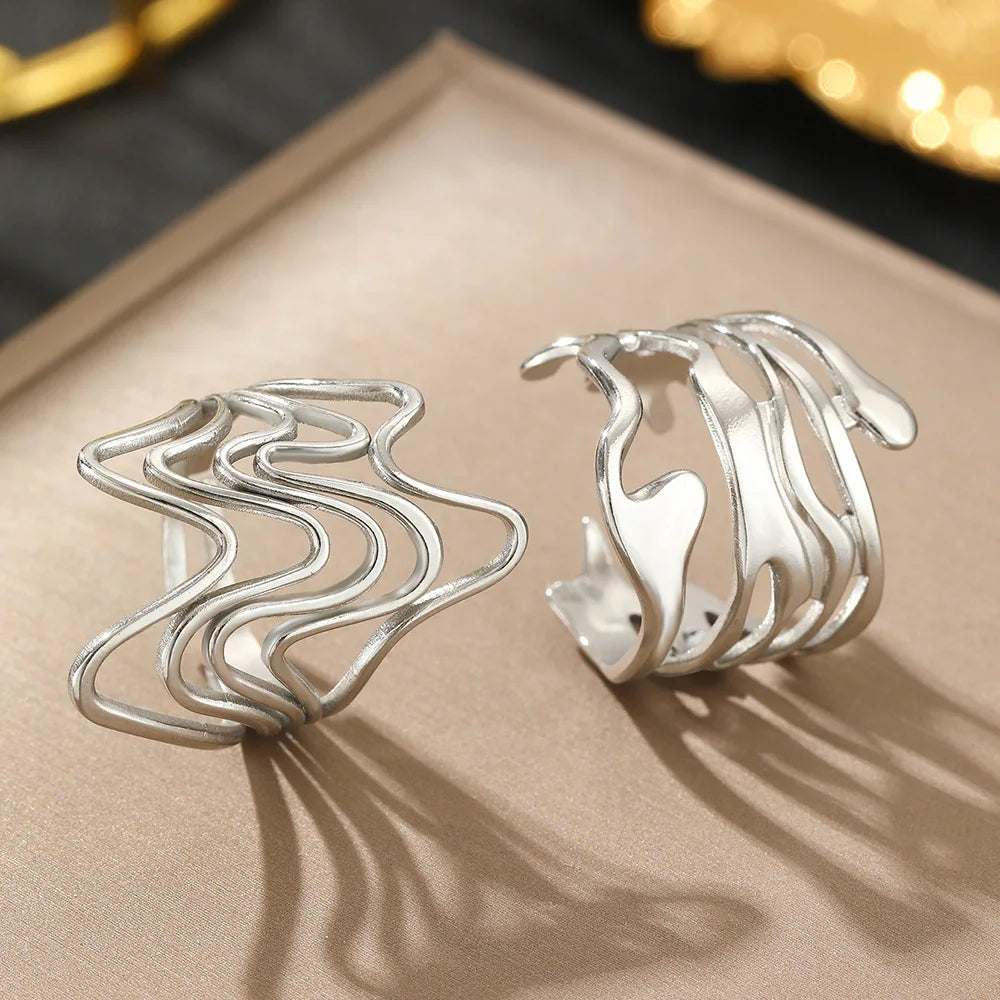 GeoPulse – טבעת גאומטרית פתוחה מנירוסטה וטיטניום