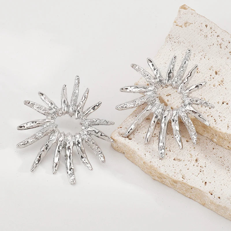 SunCharm – עגילי שמש גאומטריים